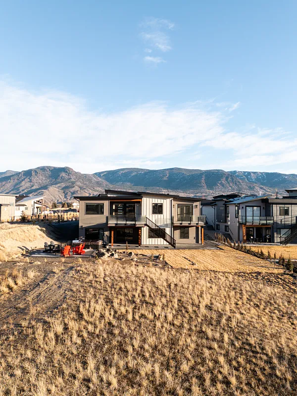 Aerial view of a custom new home build in Tobiano, BC by Double G Construction
