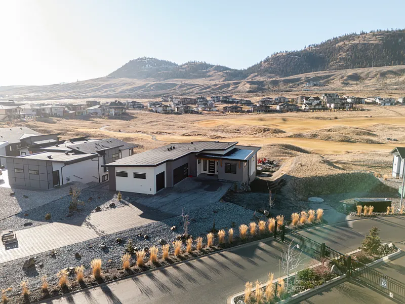 Aerial view of a custom new home build in Tobiano, BC by Double G Construction