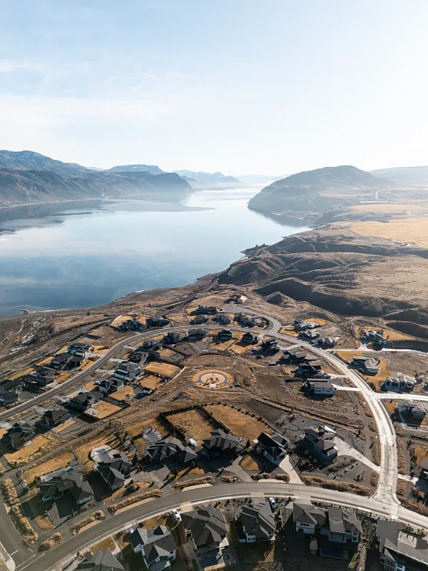 Aerial view of a custom new home build in Tobiano, BC by Double G Construction