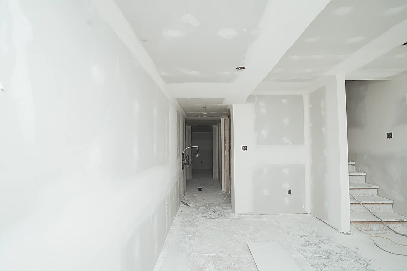 Finished drywall hallway with smooth, paint-ready walls and ceiling