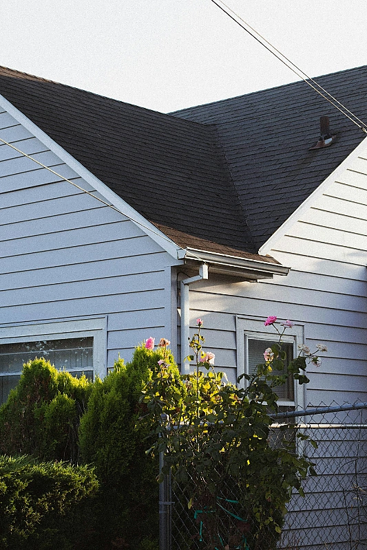 Finished dark asphalt shingle roof and gable on a residential home in the BC Interior